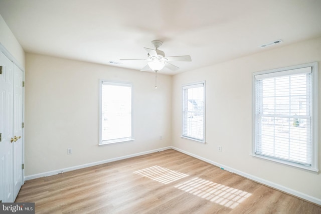 spare room with ceiling fan and light hardwood / wood-style flooring