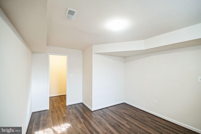 basement featuring dark wood-type flooring