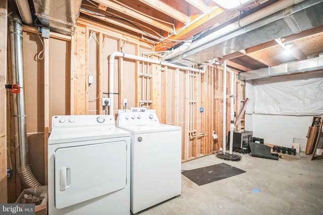 clothes washing area with washer and dryer