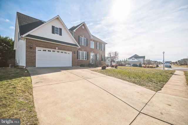 view of front of home with a garage and a front yard