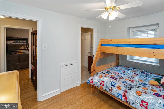 bedroom with ceiling fan and light hardwood / wood-style floors