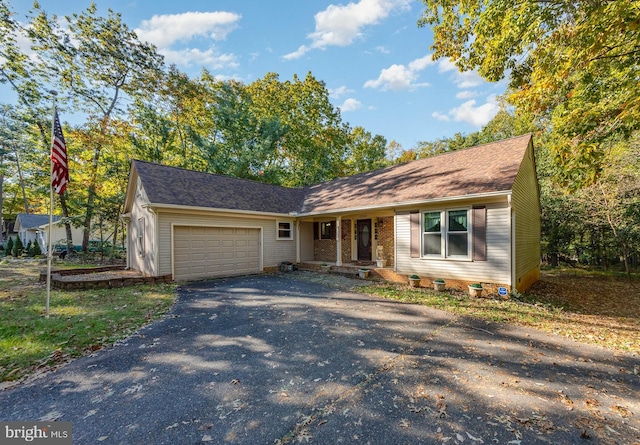 single story home with a garage