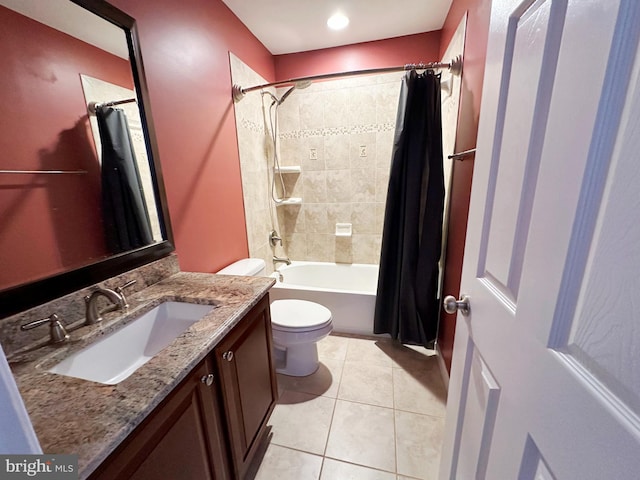 bathroom with shower / bathtub combination with curtain, vanity, toilet, and tile patterned floors