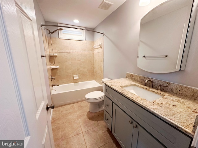 bathroom featuring bathing tub / shower combination, visible vents, toilet, vanity, and tile patterned floors