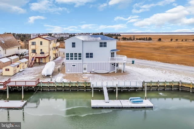 rear view of house with a water view