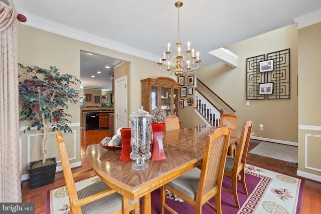 dining area with ornamental molding, dark wood-type flooring, and a chandelier