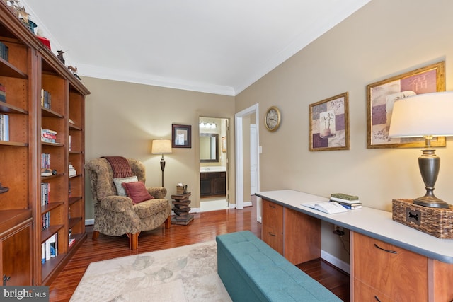 home office with crown molding and dark wood-type flooring