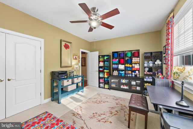 living room featuring ceiling fan and light colored carpet