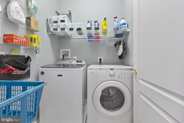 clothes washing area with independent washer and dryer