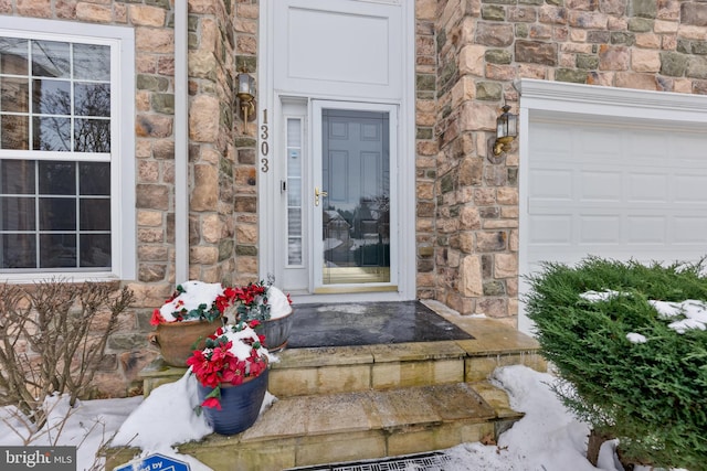 doorway to property featuring a garage