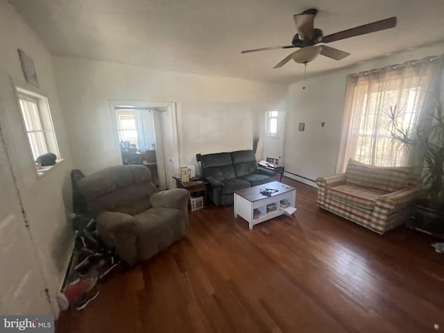 living room with ceiling fan, dark hardwood / wood-style flooring, and a baseboard radiator