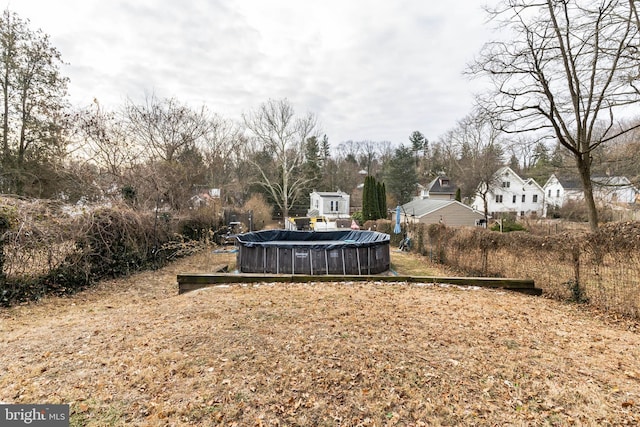 view of yard featuring a covered pool