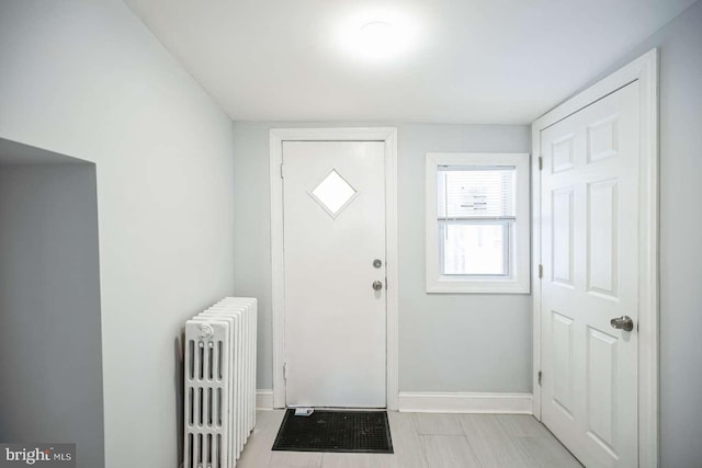 foyer entrance featuring radiator