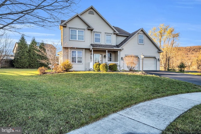 front of property with covered porch and a front yard