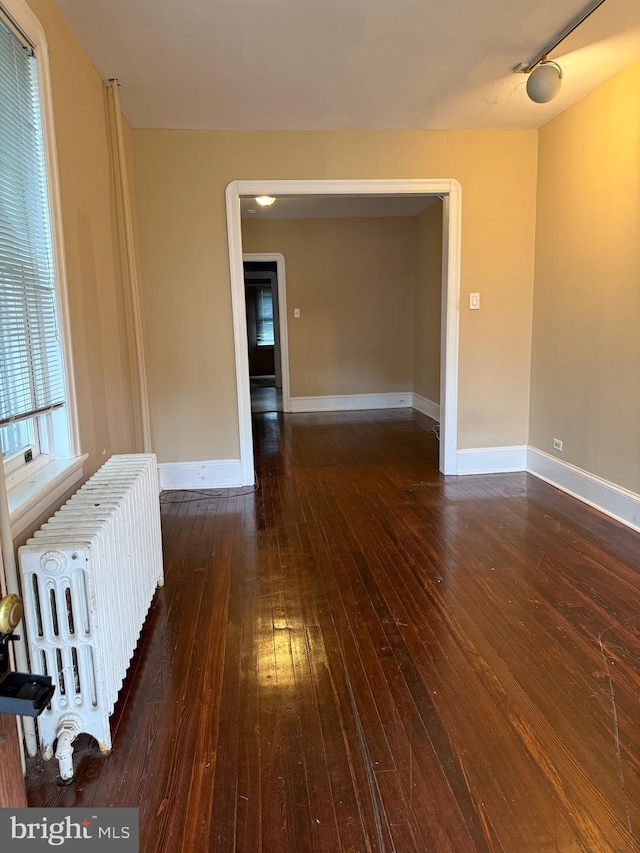 327 Jefferson Ave, Cheltenham, PA 19012 - spare room featuring radiator, baseboards, and wood-type flooring