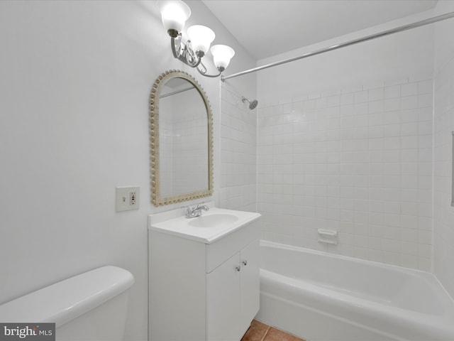 full bathroom with shower / bath combination, vanity, tile patterned floors, and toilet