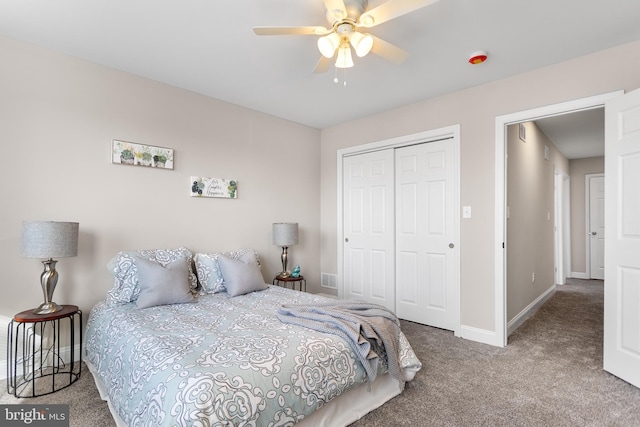 bedroom with ceiling fan, a closet, and carpet flooring