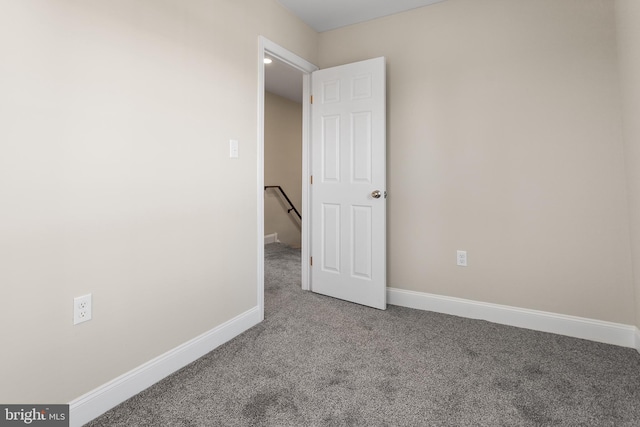 empty room with carpet flooring