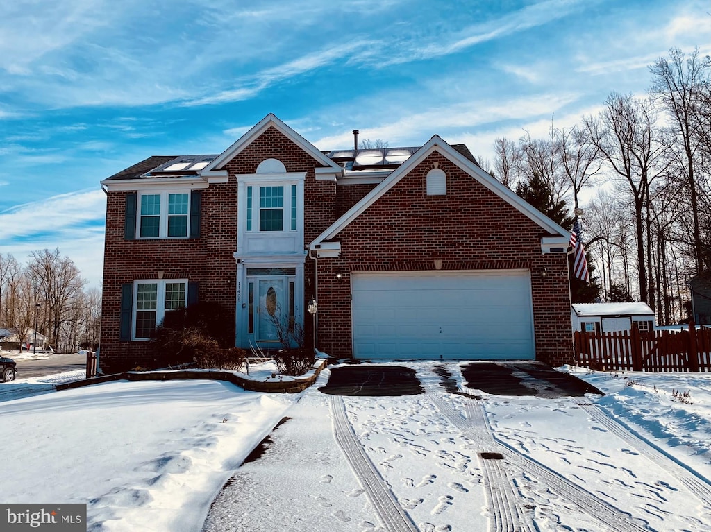 front of property with a garage