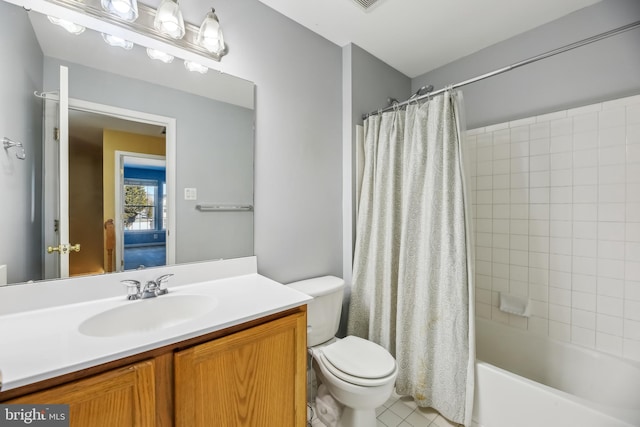 bathroom with toilet, shower / bath combo, and vanity