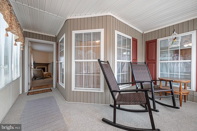 unfurnished sunroom with vaulted ceiling