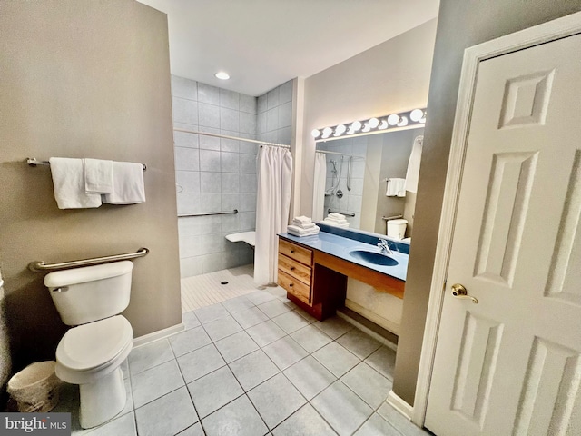 bathroom with tile patterned floors, toilet, vanity, and a shower with shower curtain