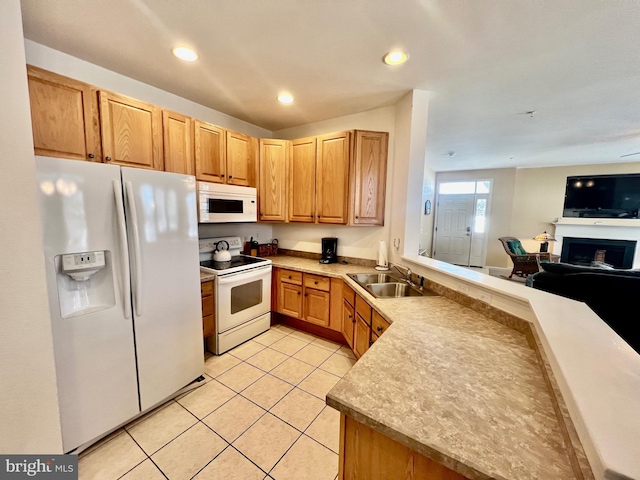 kitchen featuring kitchen peninsula, sink, light tile patterned flooring, and white appliances