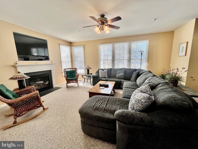 living room featuring carpet and ceiling fan