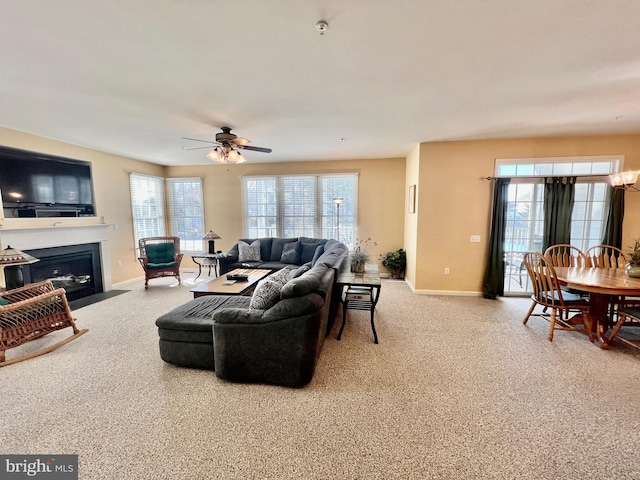 living room with carpet and ceiling fan