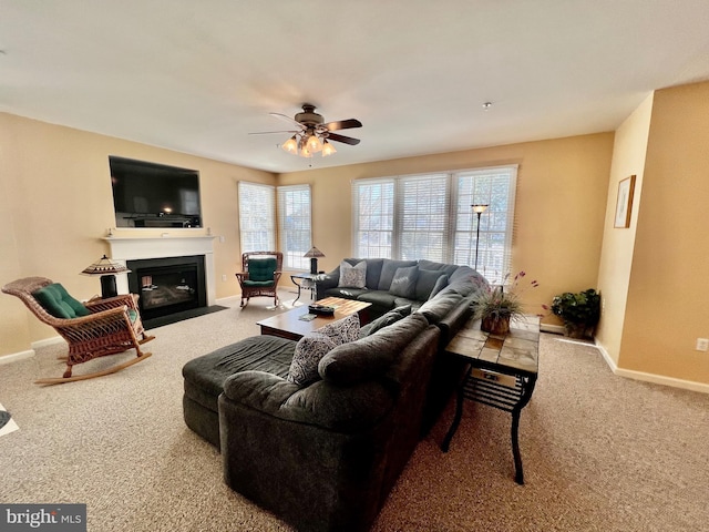 carpeted living room featuring ceiling fan