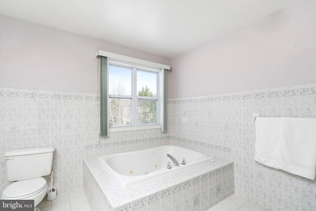 bathroom with tile walls, tile patterned floors, and toilet