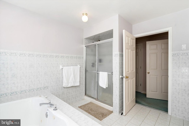 bathroom featuring tile walls, tile patterned flooring, and shower with separate bathtub