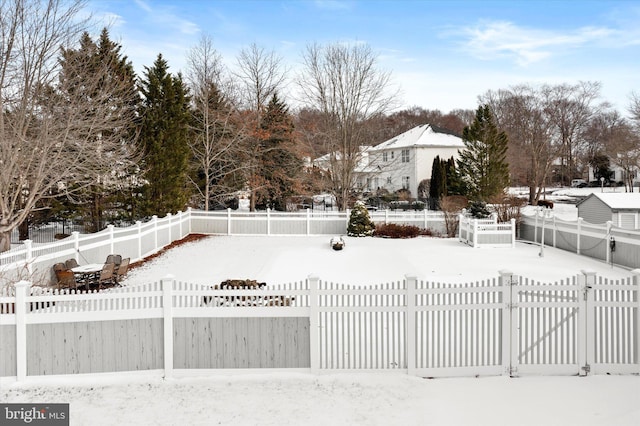 view of yard layered in snow