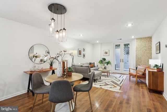 dining space with french doors and dark hardwood / wood-style floors