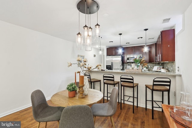 dining room featuring dark hardwood / wood-style floors