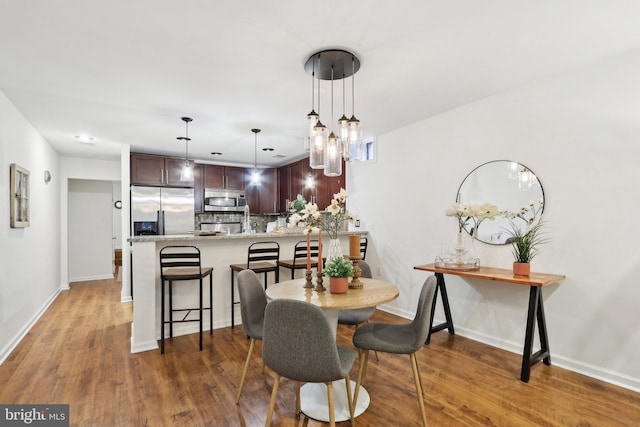 dining area featuring dark hardwood / wood-style flooring