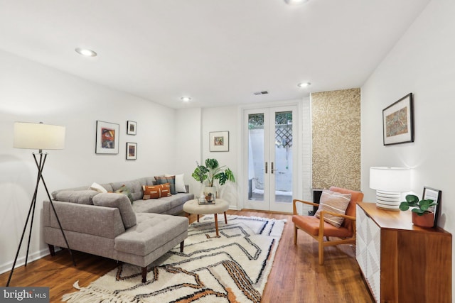 living room featuring dark wood-type flooring and french doors