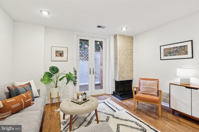 living room with hardwood / wood-style flooring and french doors