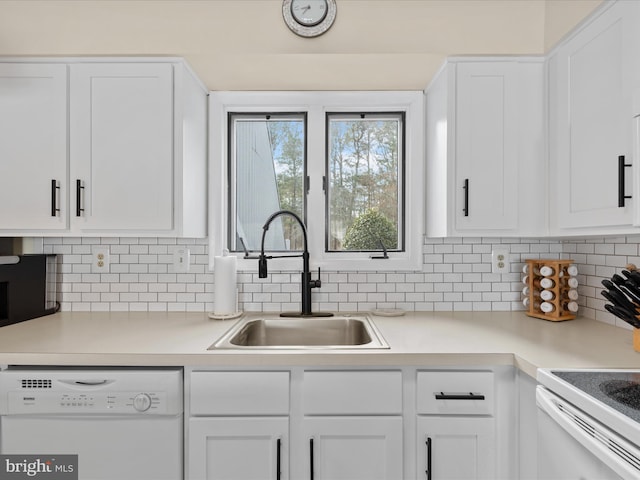 kitchen featuring electric stove, sink, dishwasher, white cabinetry, and tasteful backsplash