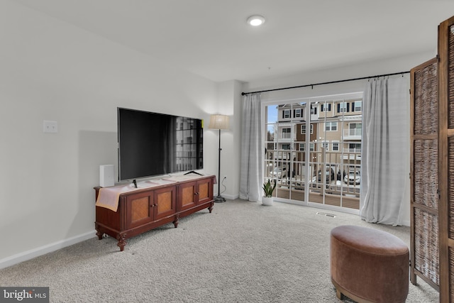 living room featuring light carpet