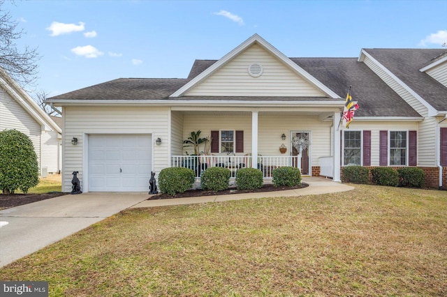 view of front of property with a porch, a garage, and a front yard