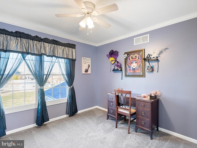 home office featuring ceiling fan, crown molding, and carpet