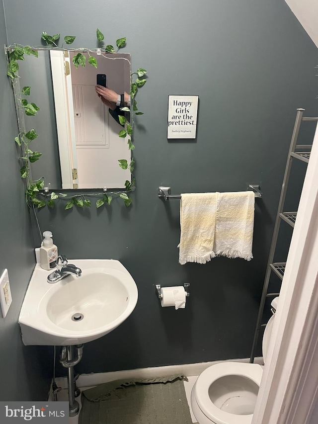 bathroom with toilet and sink