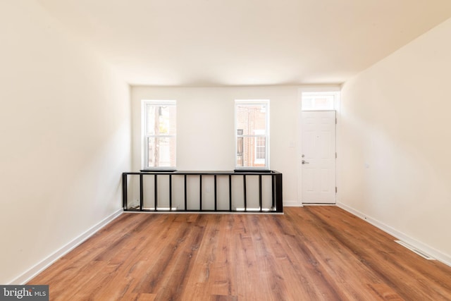 spare room featuring hardwood / wood-style floors