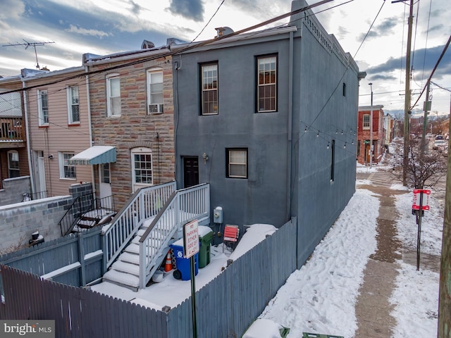 159 N Ellwood Ave, Baltimore, MD 21224 - snow covered rear of property with fence and cooling unit