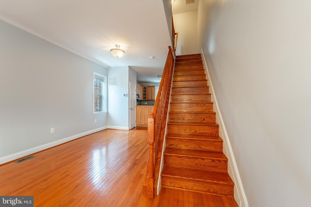 stairway featuring hardwood / wood-style flooring