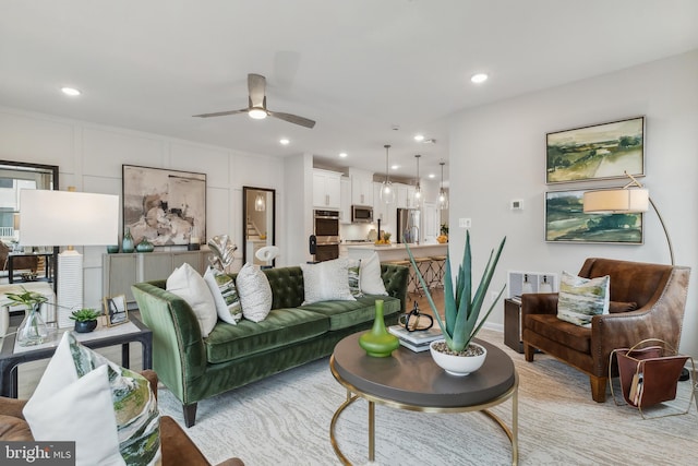 living room featuring ceiling fan