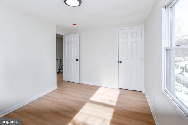 unfurnished room featuring light wood-type flooring