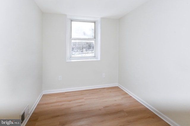 unfurnished room featuring light hardwood / wood-style floors