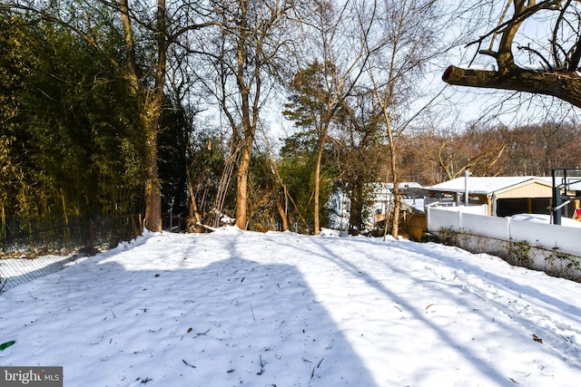 view of yard layered in snow